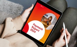 DIN-A4 Bericht wird in der Hand gehalten. Das neue Payment - Die Zukunft des Bezahlens.